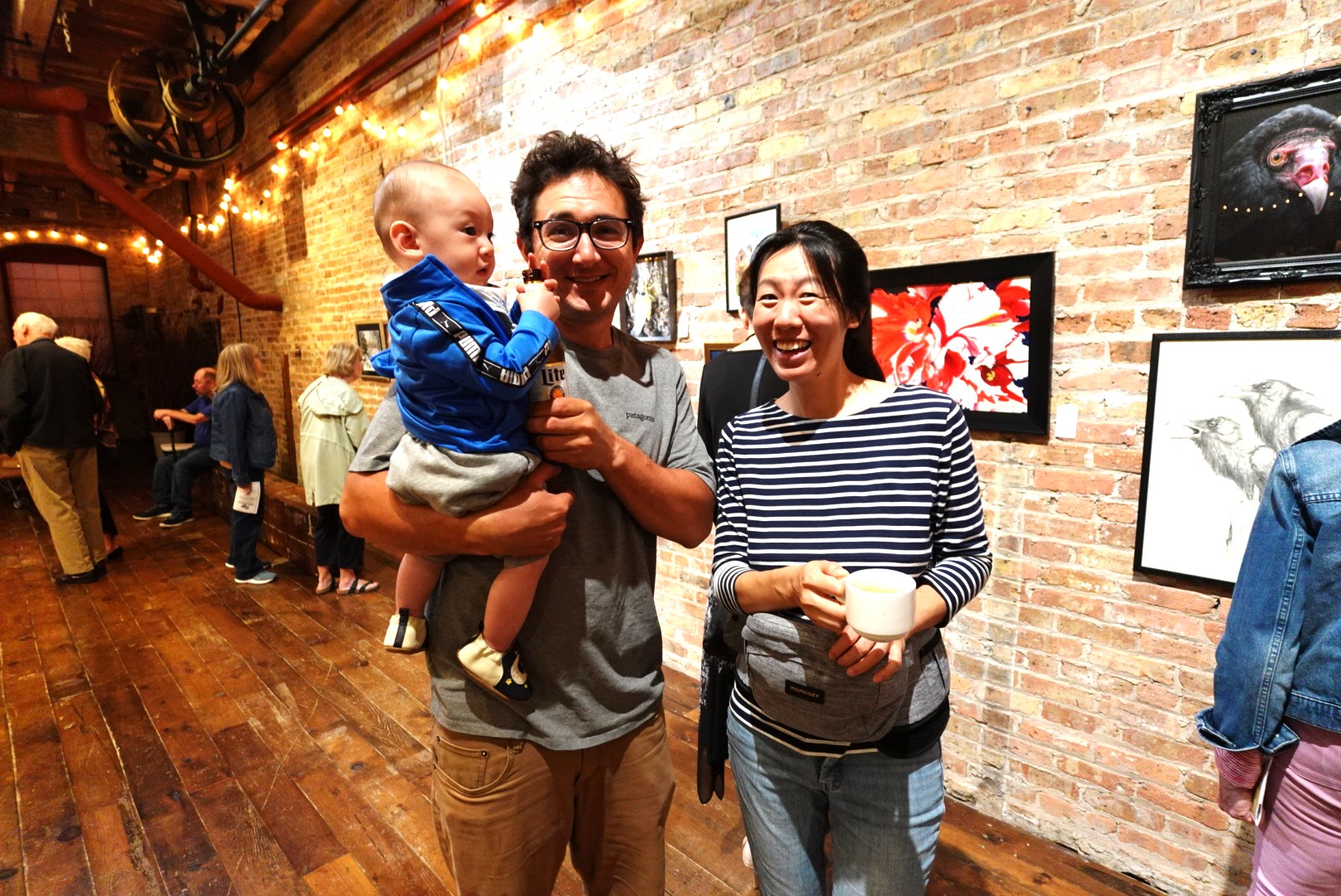 A couple and their baby at Art of the Land