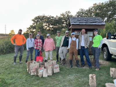 A group of people collecting native seed